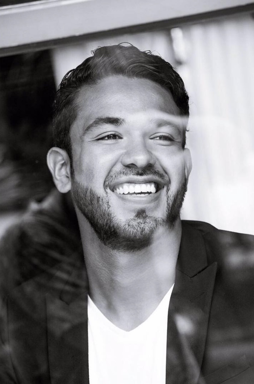 Black and white portrait of Jeremy Avalos wearing a blazer